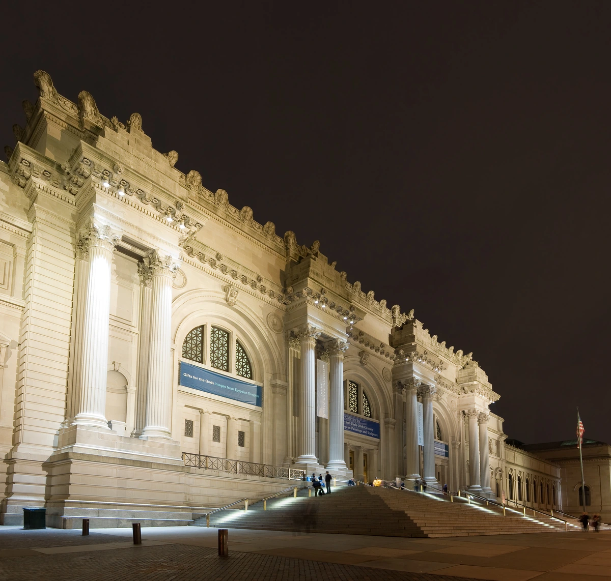 The grand neoclassical facade of The Metropolitan Museum of Art in New York City, demonstrating monumental scale and public presence.