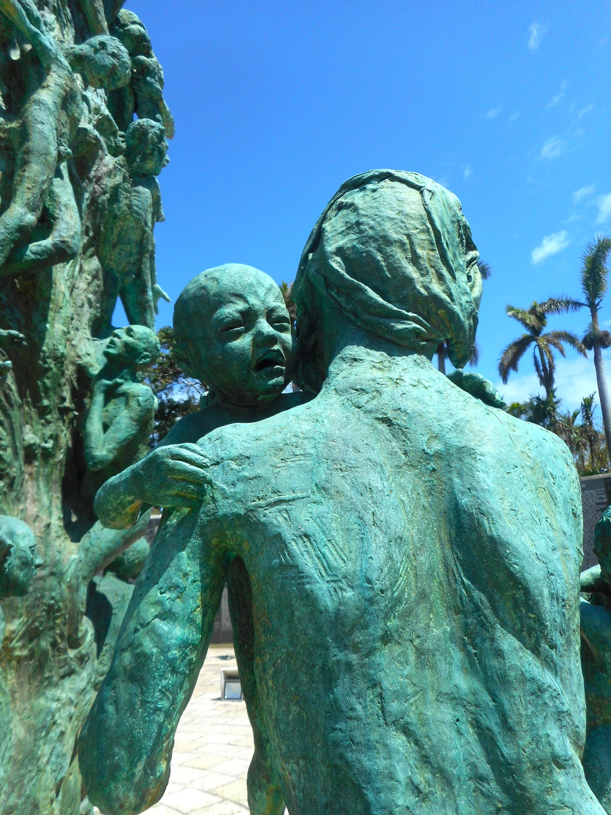 Sculpture of a child crying and clinging to an adult at the Holocaust Memorial in Miami Beach