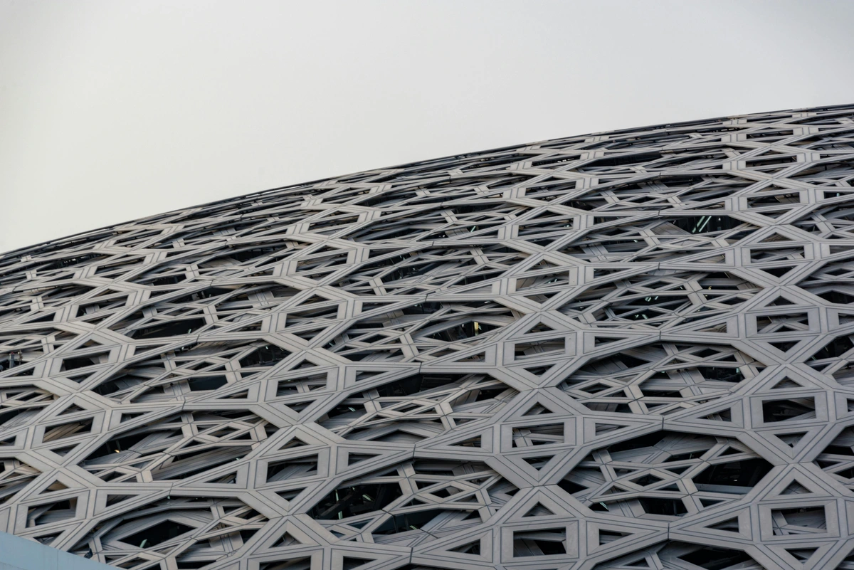 Close-up of the intricate geometric roof pattern of the Louvre Abu Dhabi museum.