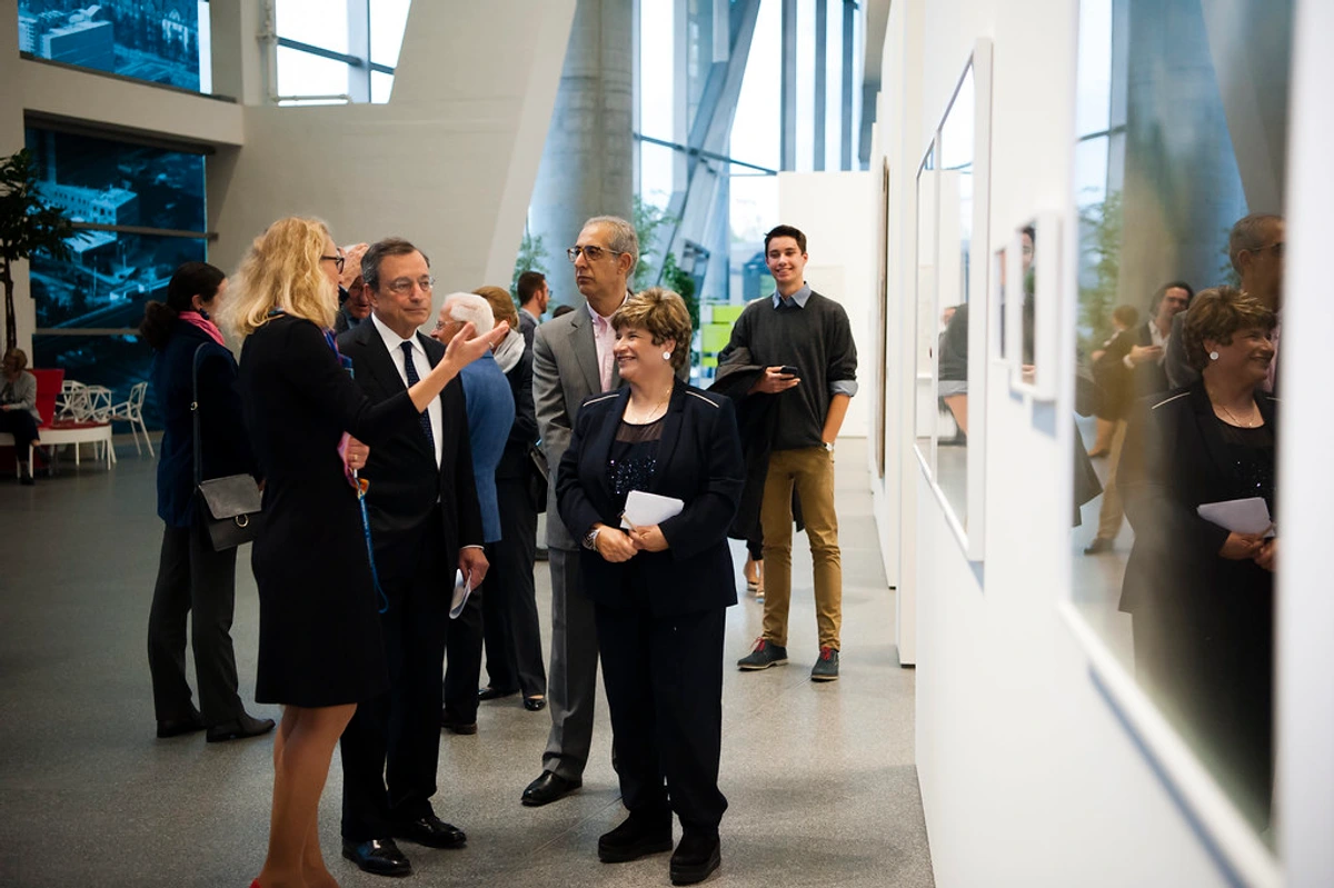 Attendees discuss artwork during the Cyprus Contemporary Art Exhibition opening in September 2015.
