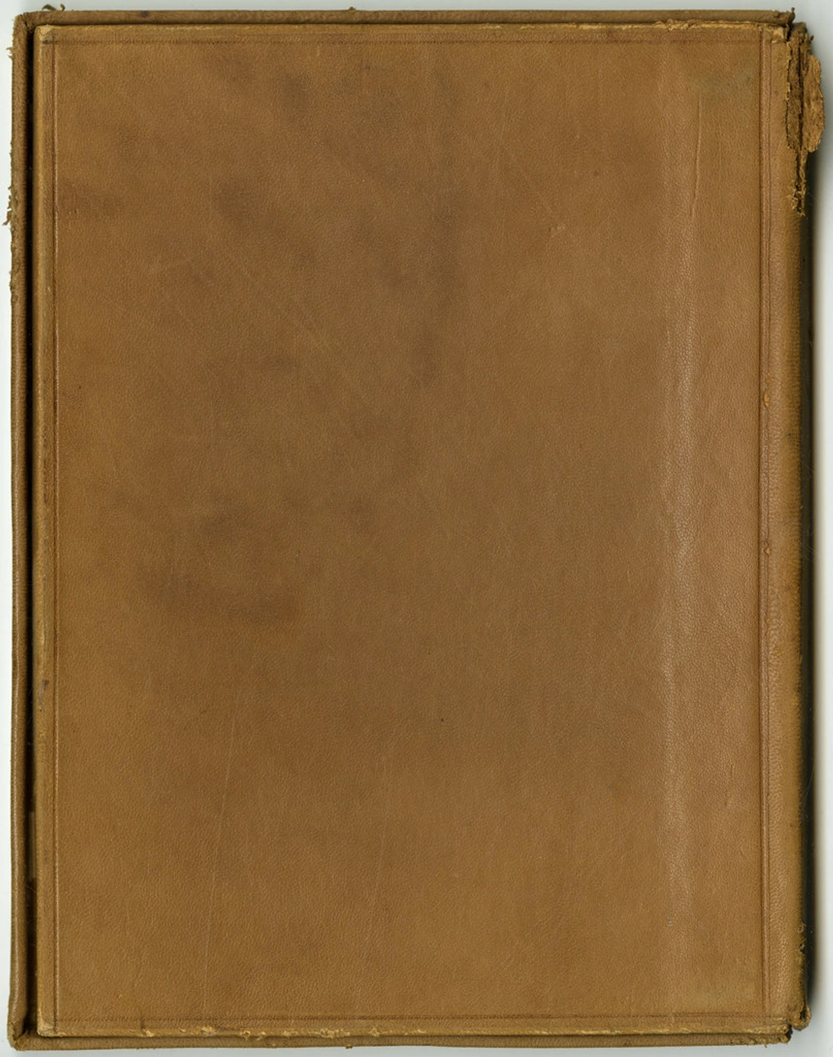 Brown leather-bound antique book with corner damage, stock photo for art conservation documentation