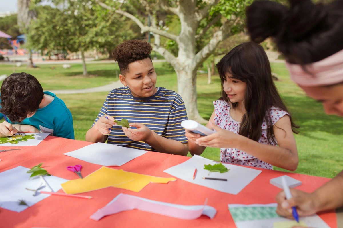 Free stock photo of art camp for kids, creative drawing activities, and outdoor art projects, promoting youth art education and creativity.