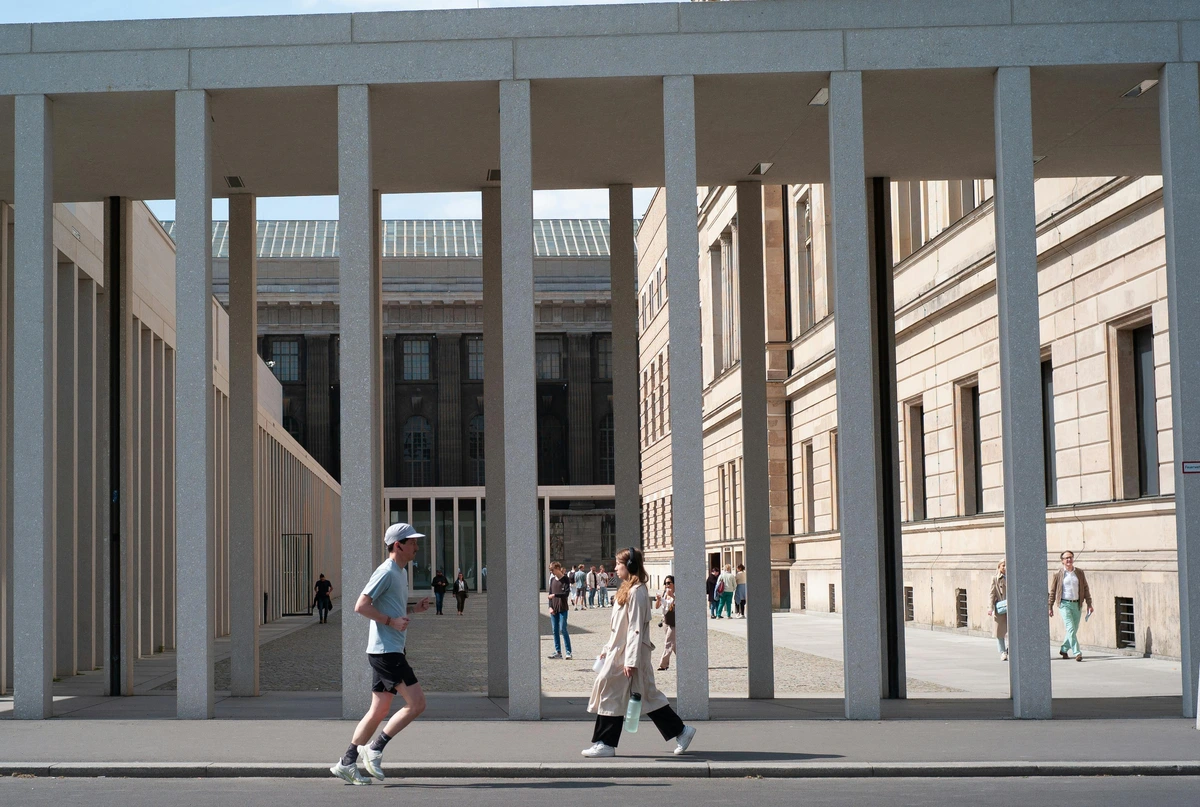 people walking outside james simon gallery berlin germany highlighting art museum visitors and architectural details
