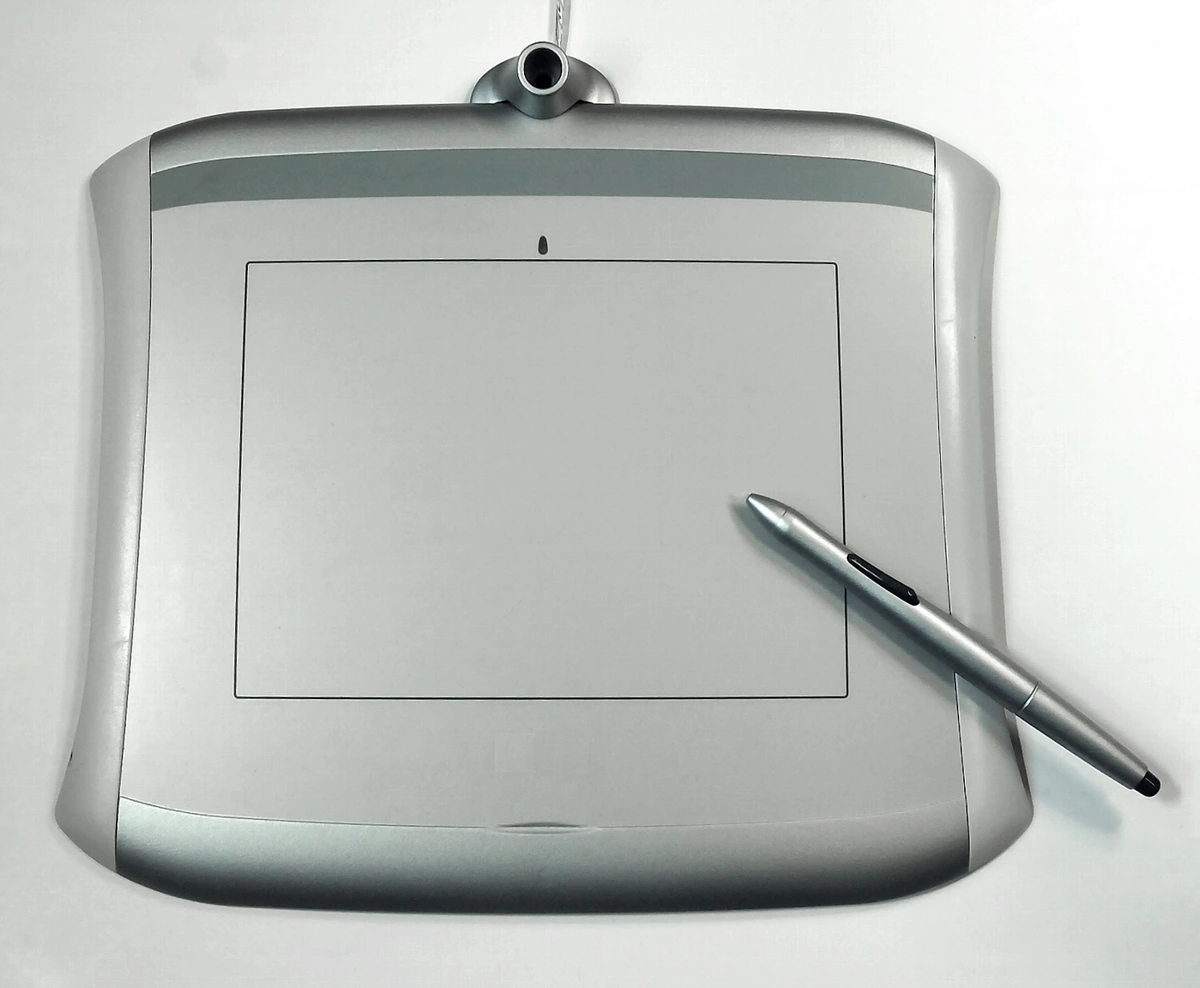 Silver pen tablet with a stylus resting on its surface, ideal for beginners.