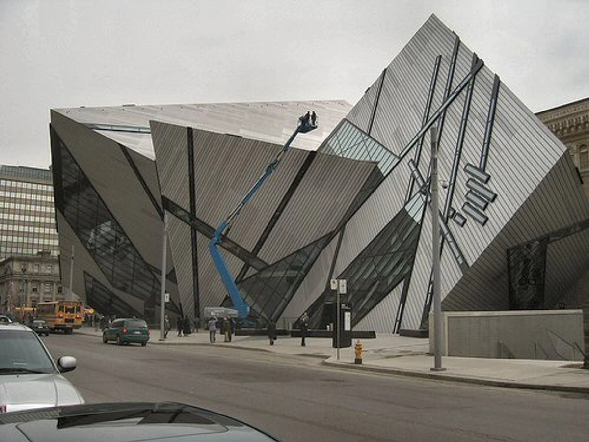The Royal Ontario Museum (ROM) in Toronto, Canada, showcasing its distinctive modern crystal-like architecture with angular glass and metal facades.