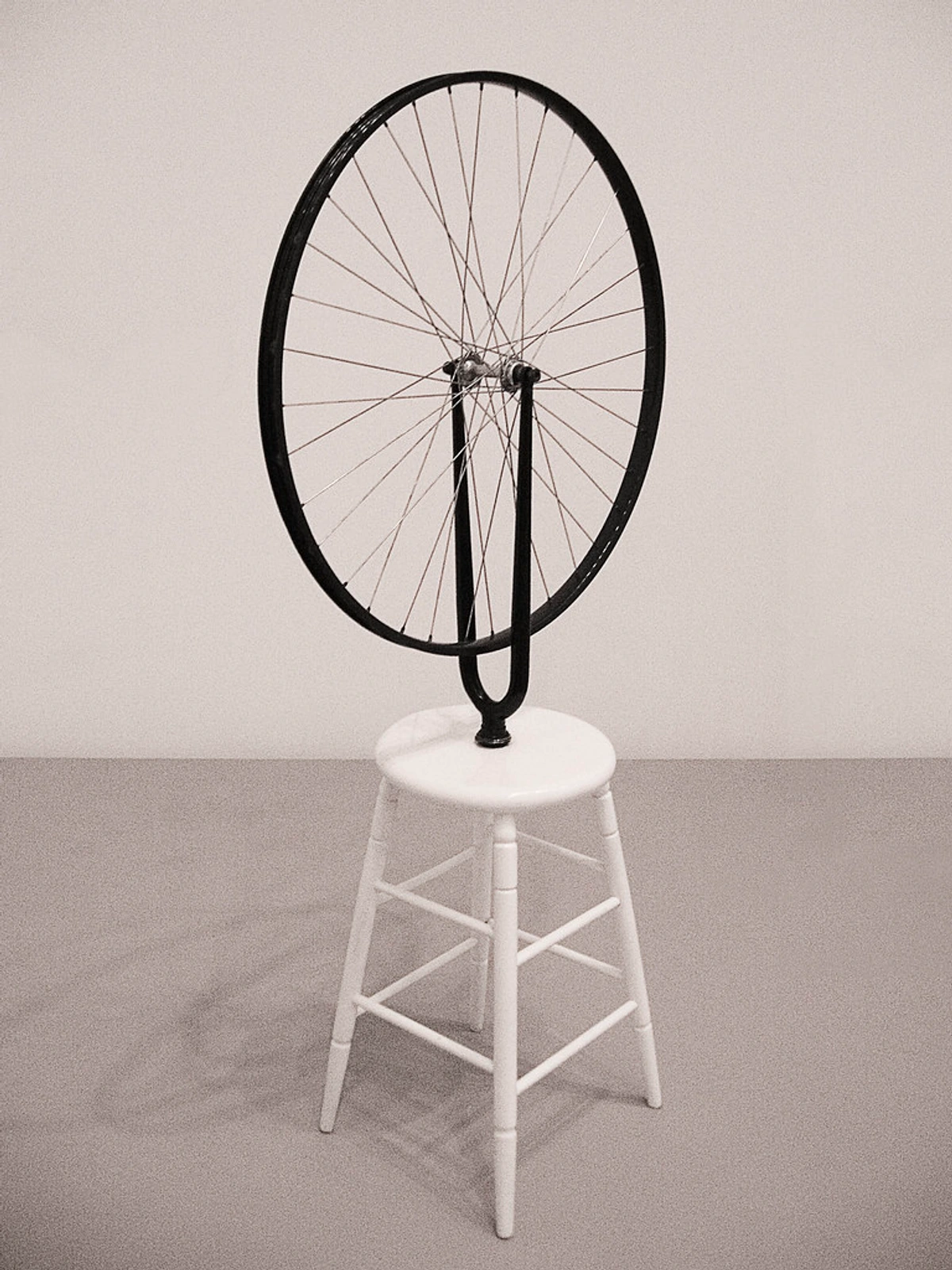 Bicycle Wheel on Stool Stand art installation by Marcel Duchamp influence