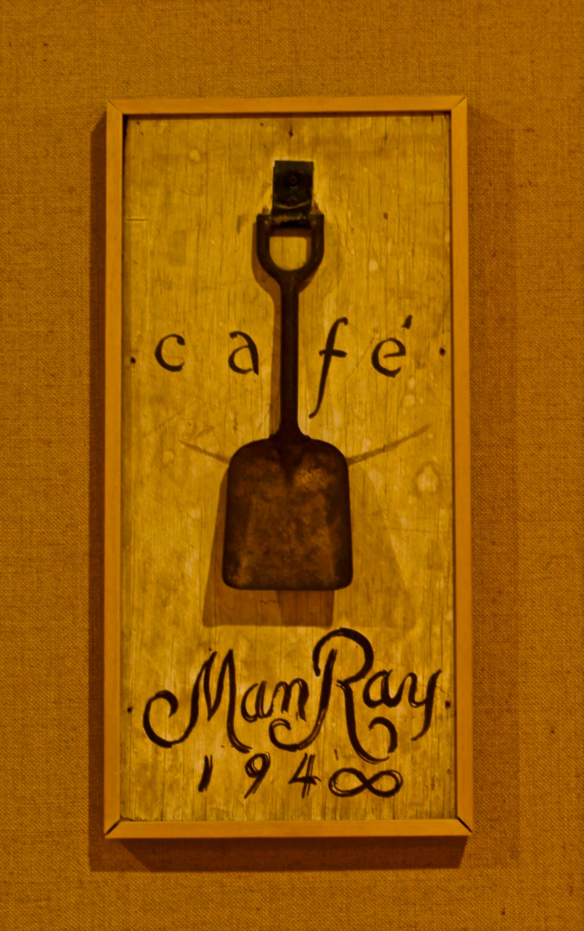 Cafe Man Ray artwork by Man Ray, 1948, featuring a shovel and the artist's name.