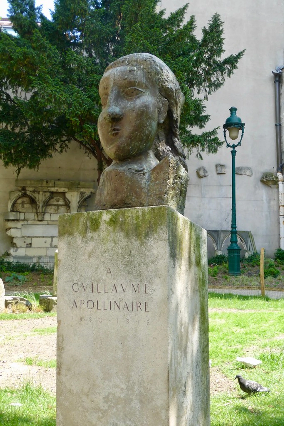 A bust of Guillaume Apollinaire at a memorial site in Paris, linked to Picasso's circle.