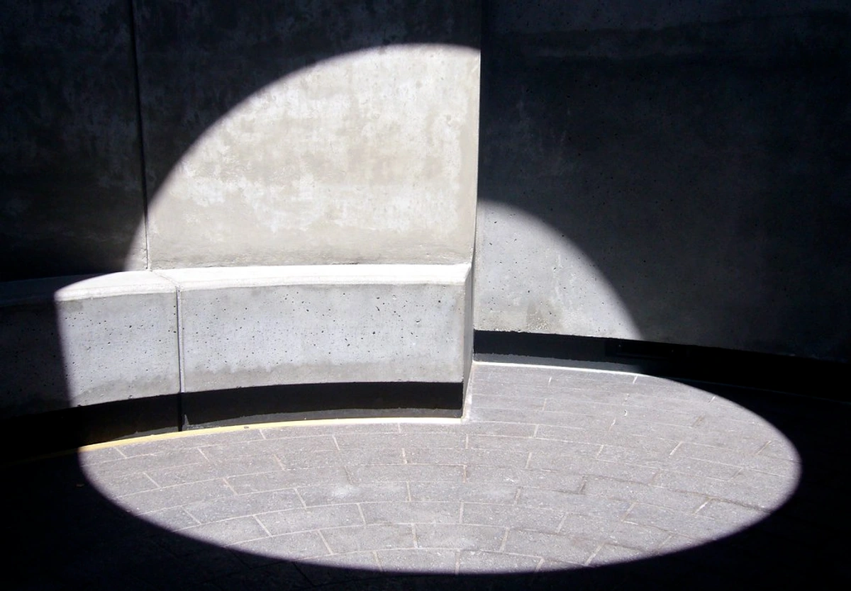 Experience James Turrell's Three Gems Skyspace: an immersive light installation blending sky and light in a concrete dome.