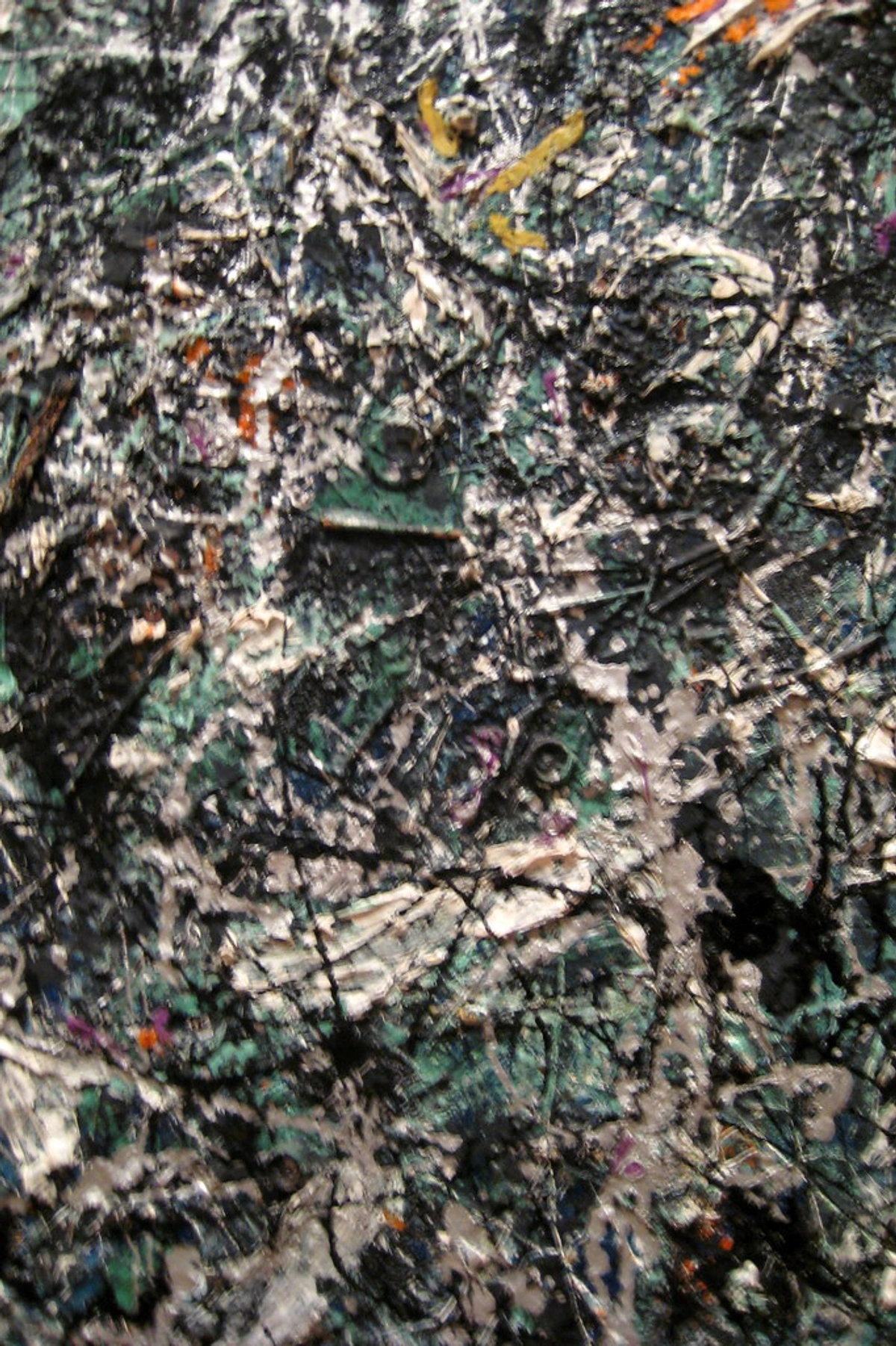 Close-up detail of Jackson Pollock's abstract expressionist painting 'Full Fathom Five', showcasing intricate layers of paint and texture.