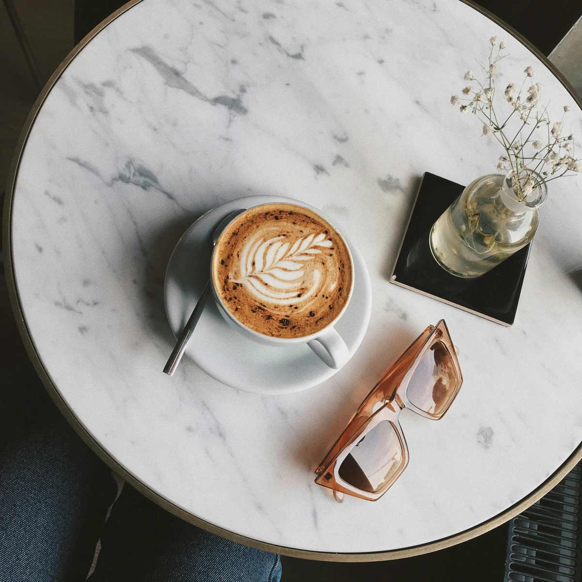 cup-of-coffee-on-marble-table-with-latte-art