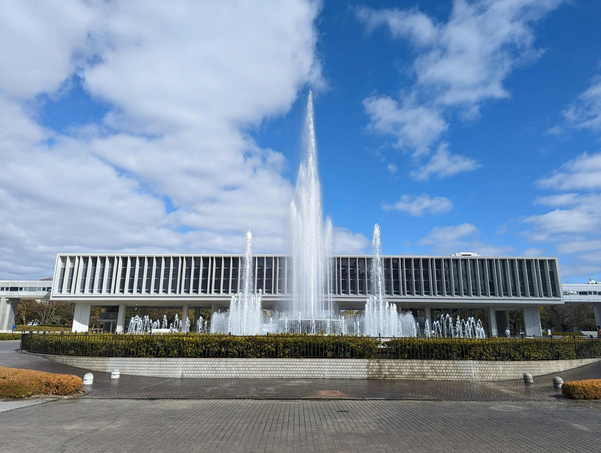 Free art museum with fountain in front, showcasing Japanese modernist architecture and landscaped public space