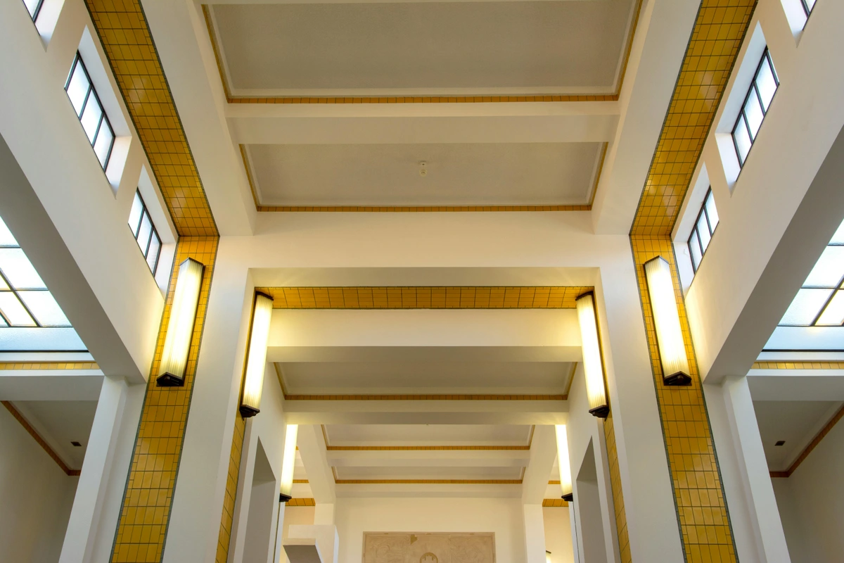 Interior ceiling and lighting of the Gemeentemuseum in The Hague, showcasing modern architectural harmony and public space elegance.