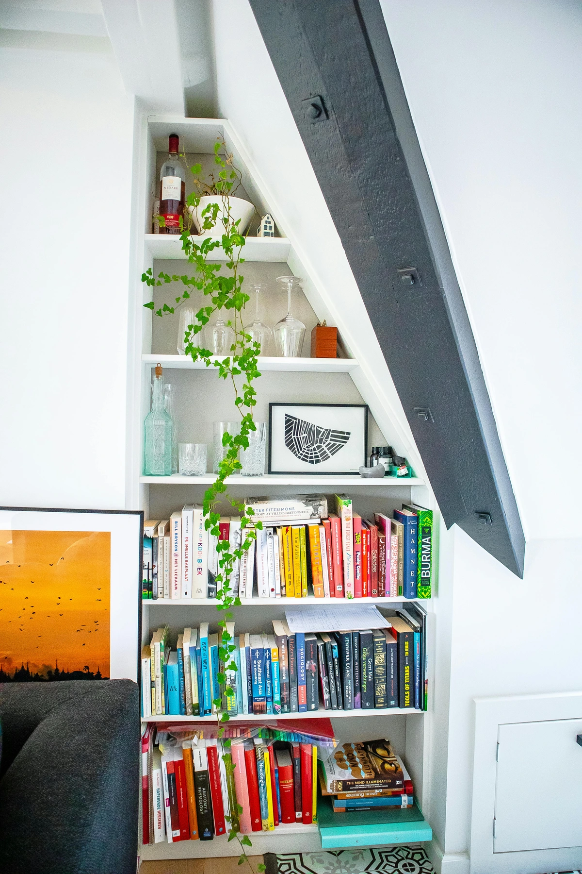 Shelves with books and decorative items, showcasing art display ideas on bookshelves.