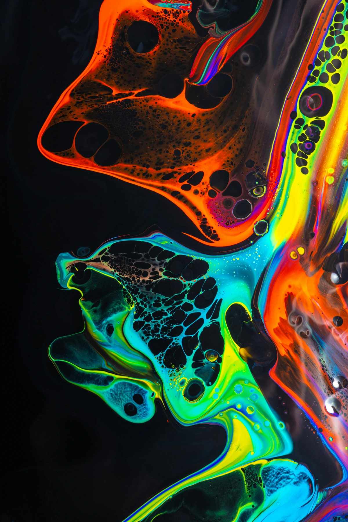 neon-paint-mixing-process-on-dark-surface