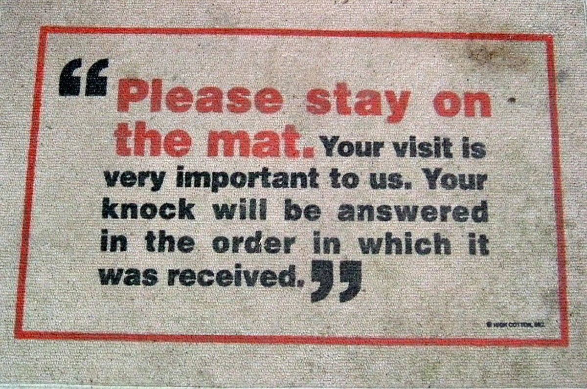 Doormat with the message 'Please stay on the mat. Your visit is very important to us. Your knock will be answered in the order in which it was received.'