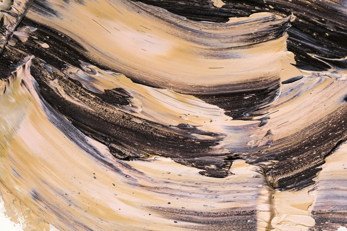 Close-up of multicolored oil paint smudges on canvas
