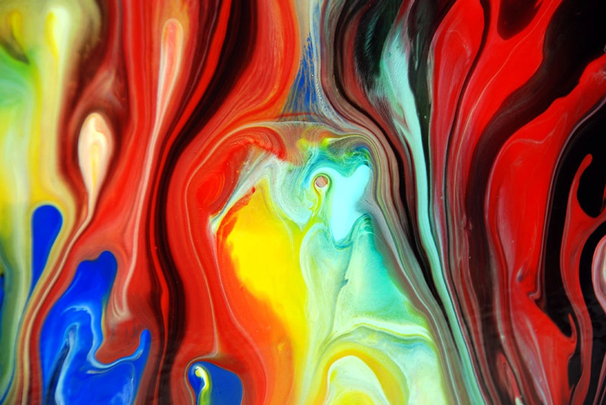Abstract fluid painting showcasing dynamic brushstrokes and vibrant colors representing the creative spirit of artists.