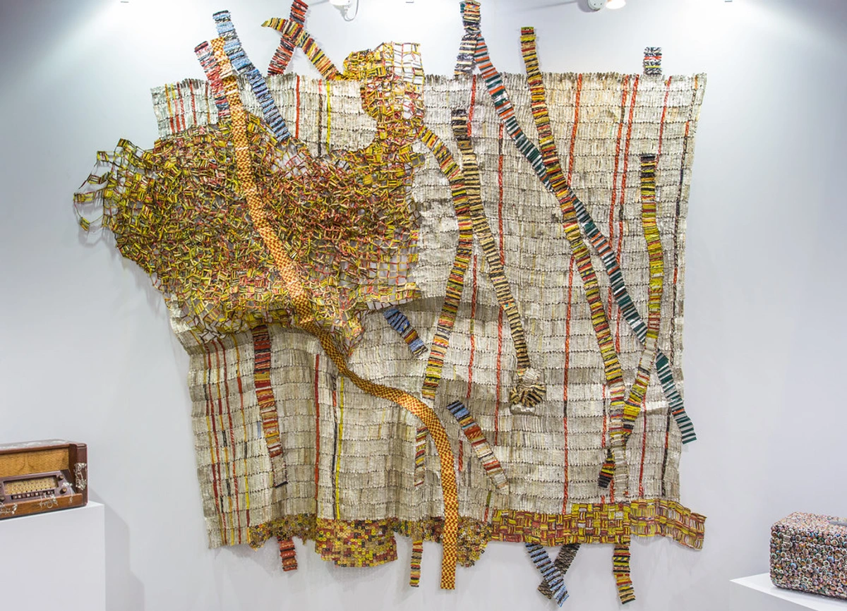 Abstract sculpture by El Anatsui made from recycled materials, showcasing innovative art and cultural symbolism.