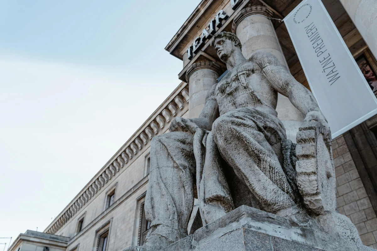 Ancient statue in low-angle view on pedestal