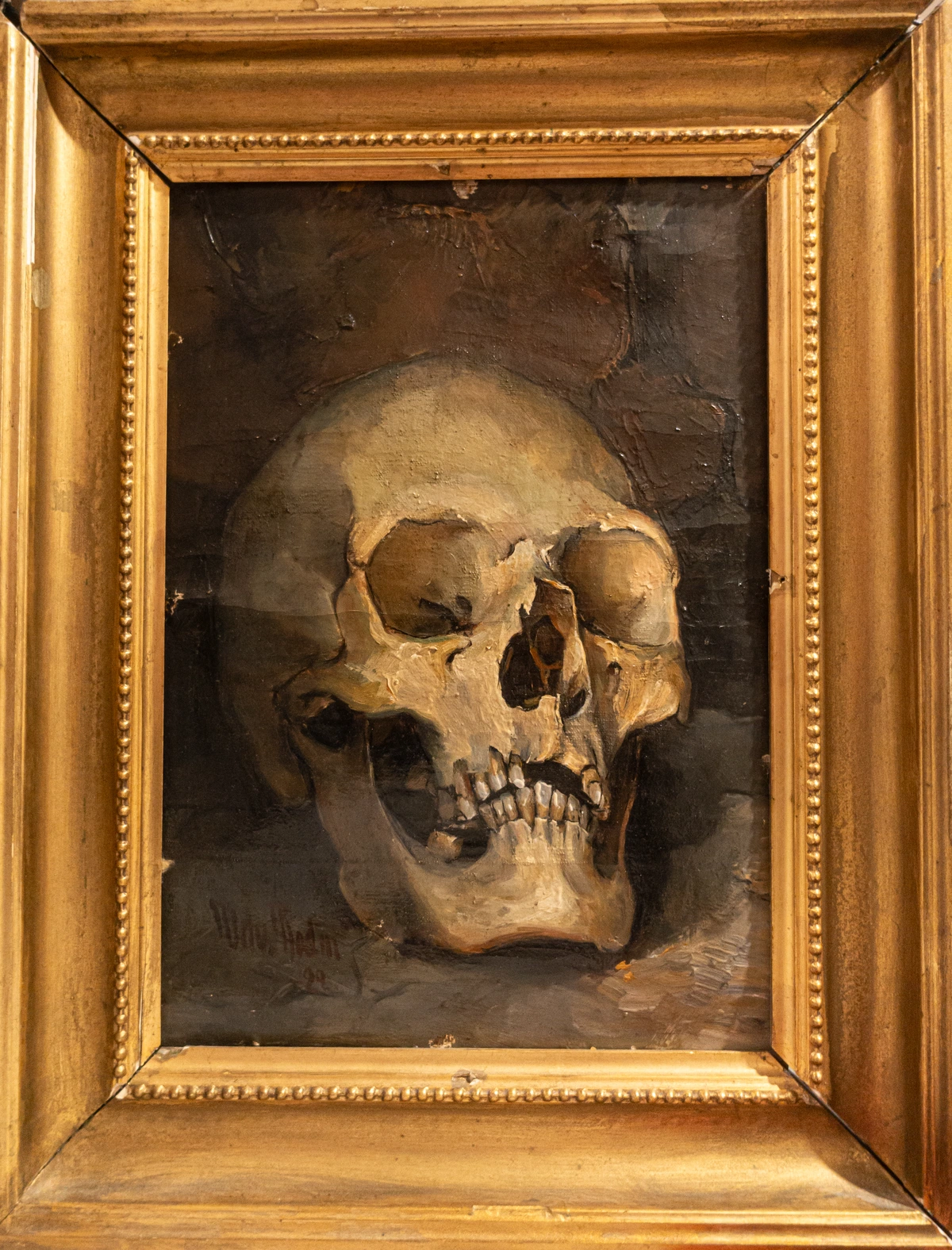 Oil painting of a human skull, symbolizing mortality and the passage of time in art history.