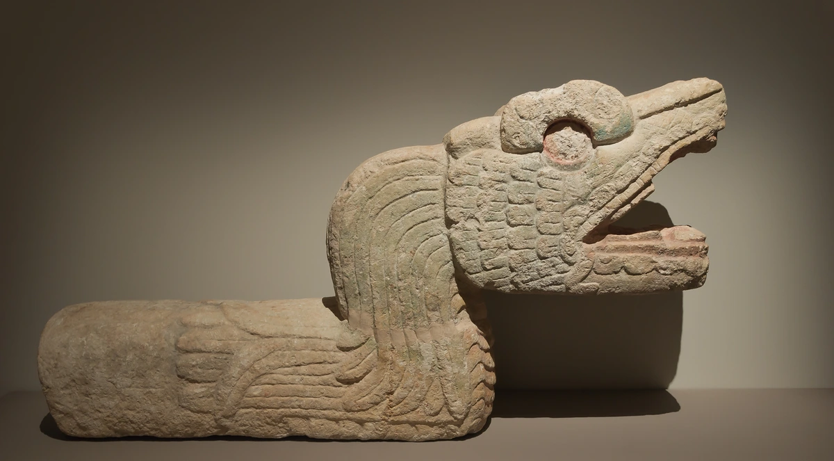Feathered Serpent sculpture from Chichen Itza, representing Quetzalcoatl, a significant deity in Mesoamerican mythology.