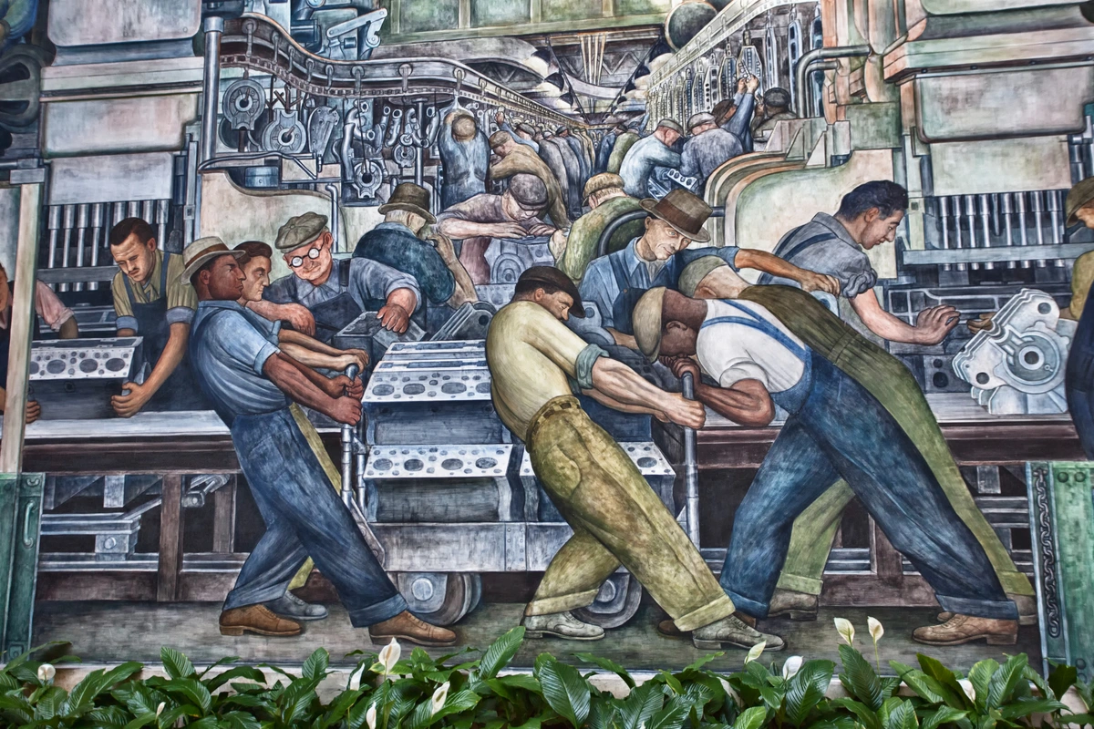 Diego Rivera mural depicting workers in an industrial setting, possibly a factory or assembly line, engaged in labor.