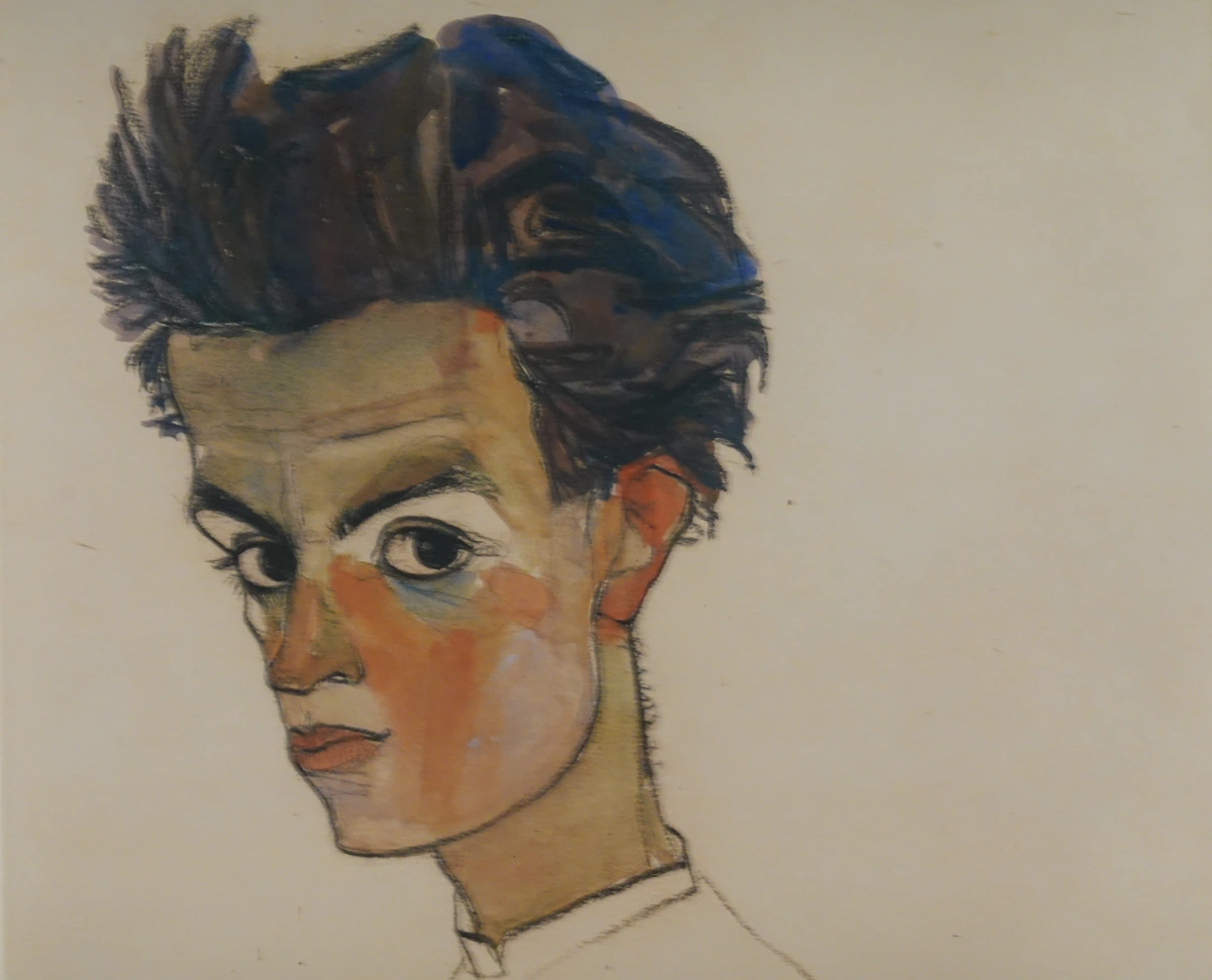Egon Schiele Self Portrait 1910, a striking watercolor and pencil drawing of the artist's head and shoulders, showcasing his intense gaze and distinctive style. | Egon Schiele Zelfportret 1910, een opvallende aquarel en potloodtekening van het hoofd en de schouders van de kunstenaar, met zijn intense blik en kenmerkende stijl.