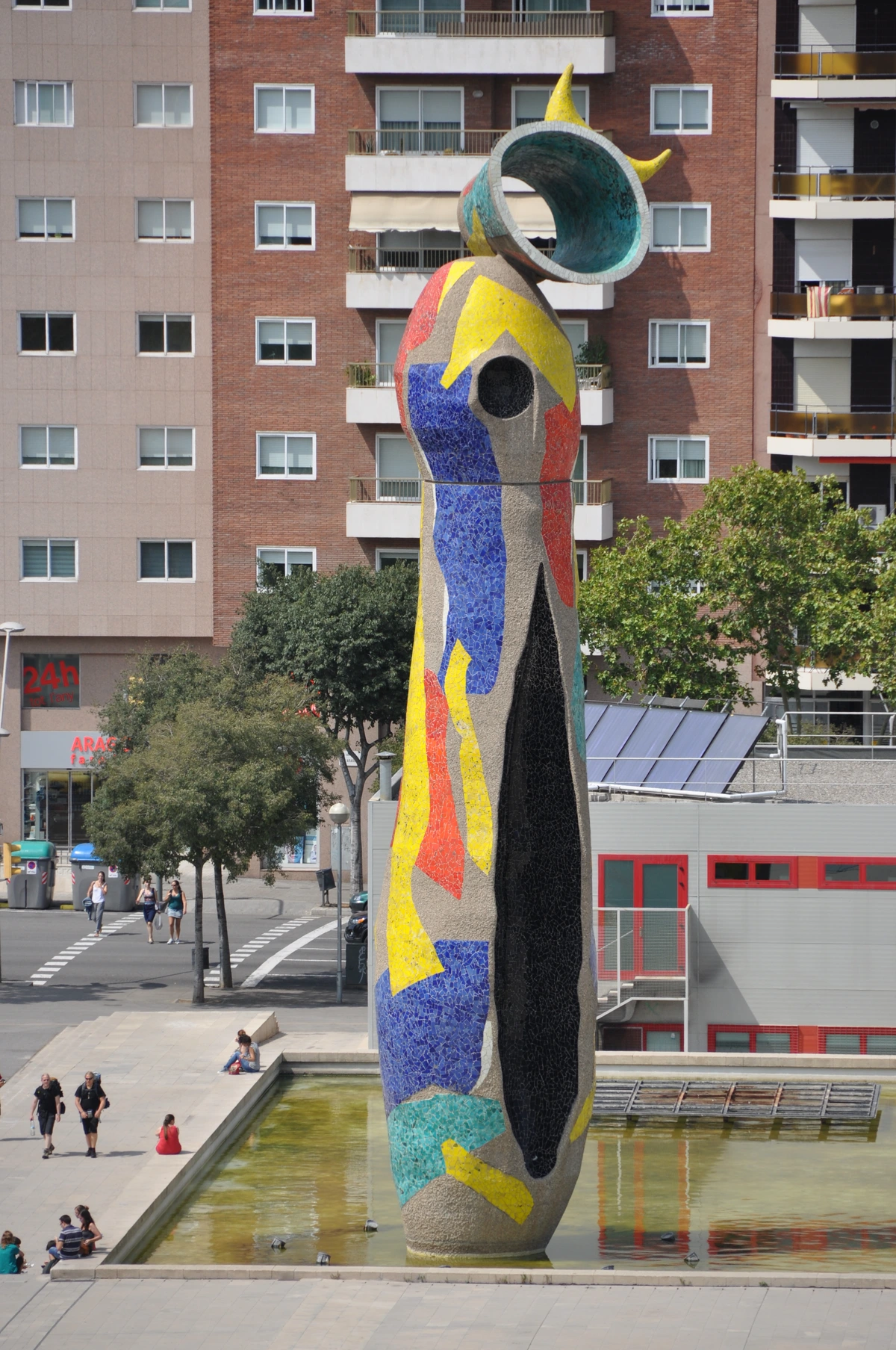 The colorful mosaic sculpture 'Dona i ocell' by Joan Miró in Parc de Joan Miró, Barcelona, reflecting a vibrant city
