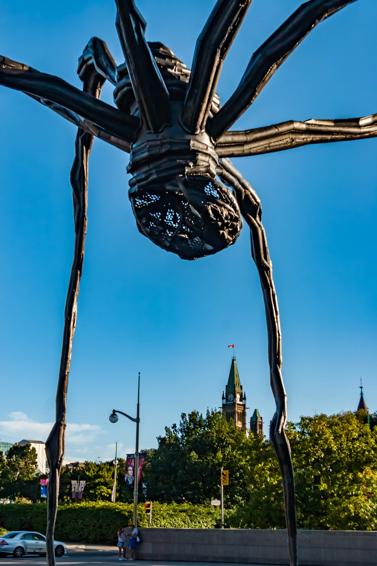 Giant Maman spider sculpture by Louise Bourgeois in front of the Canadian Parliament buildings.