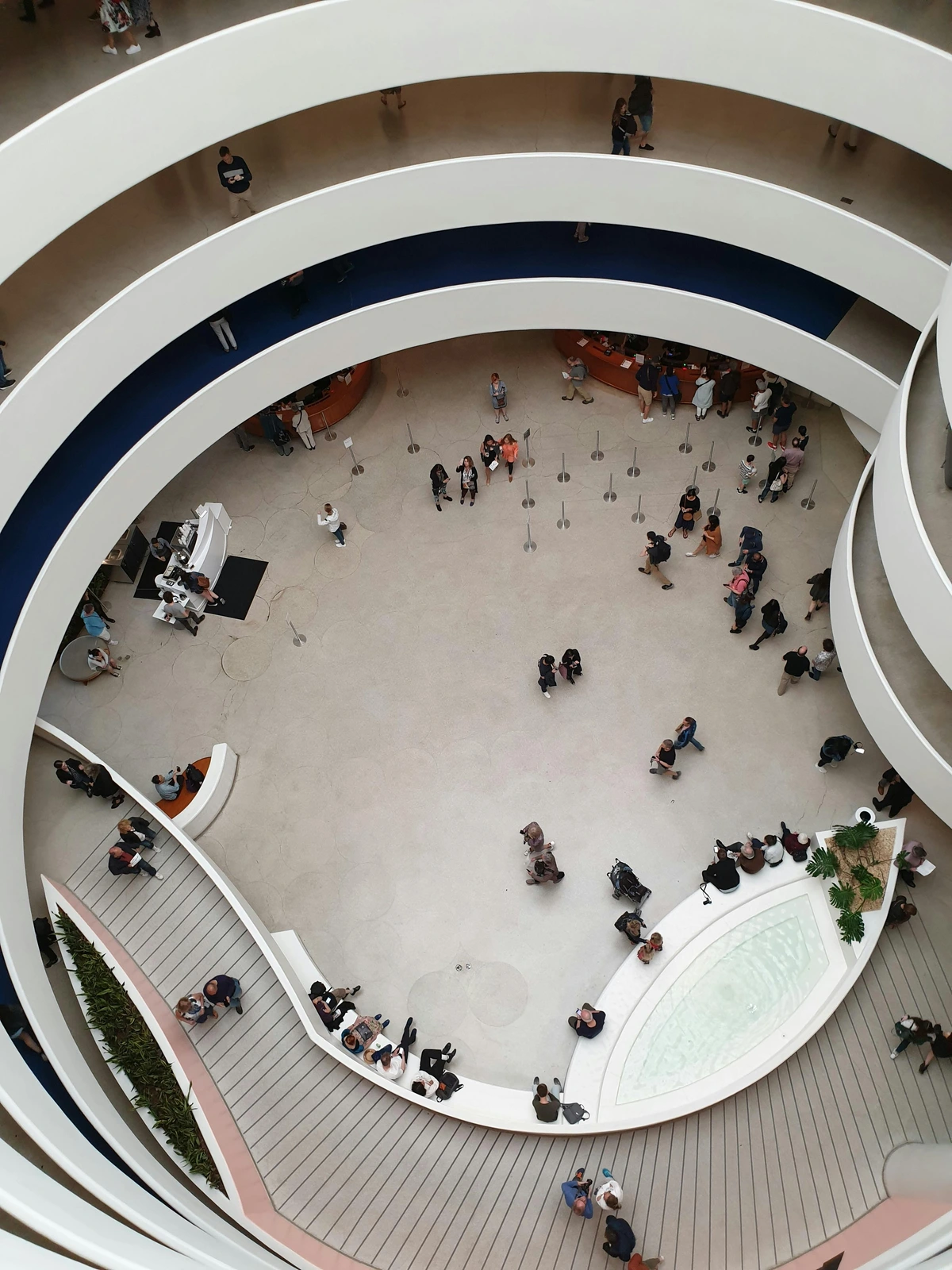 Interior view of the Guggenheim Museum of Art, highlighting the famous spiral staircase and modern architectural design, located on the Upper East Side of New York City. Visitors explore its unique circular layout and contemporary art exhibits. Frank Lloyd Wright’s iconic design, art exhibitions, and cultural landmarks are featured prominently in this high-quality photo of one of NYC’s most iconic institutions.