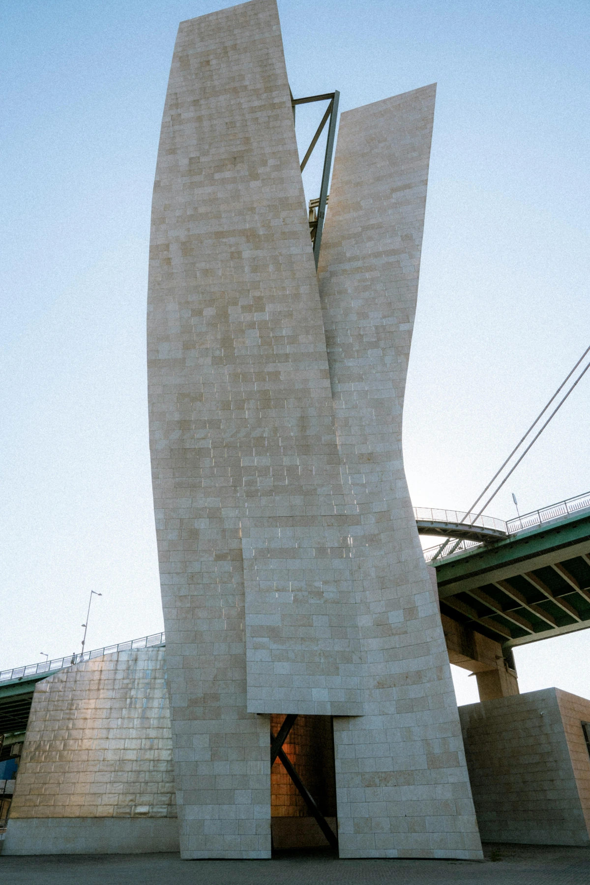 Exterior of the Museum exterior of the Guggenheim Museum Bilbao, a modern architectural marvel with reflective titanium panels. Bilbao Museum of Art, Reflective Surface, Titanium Structure