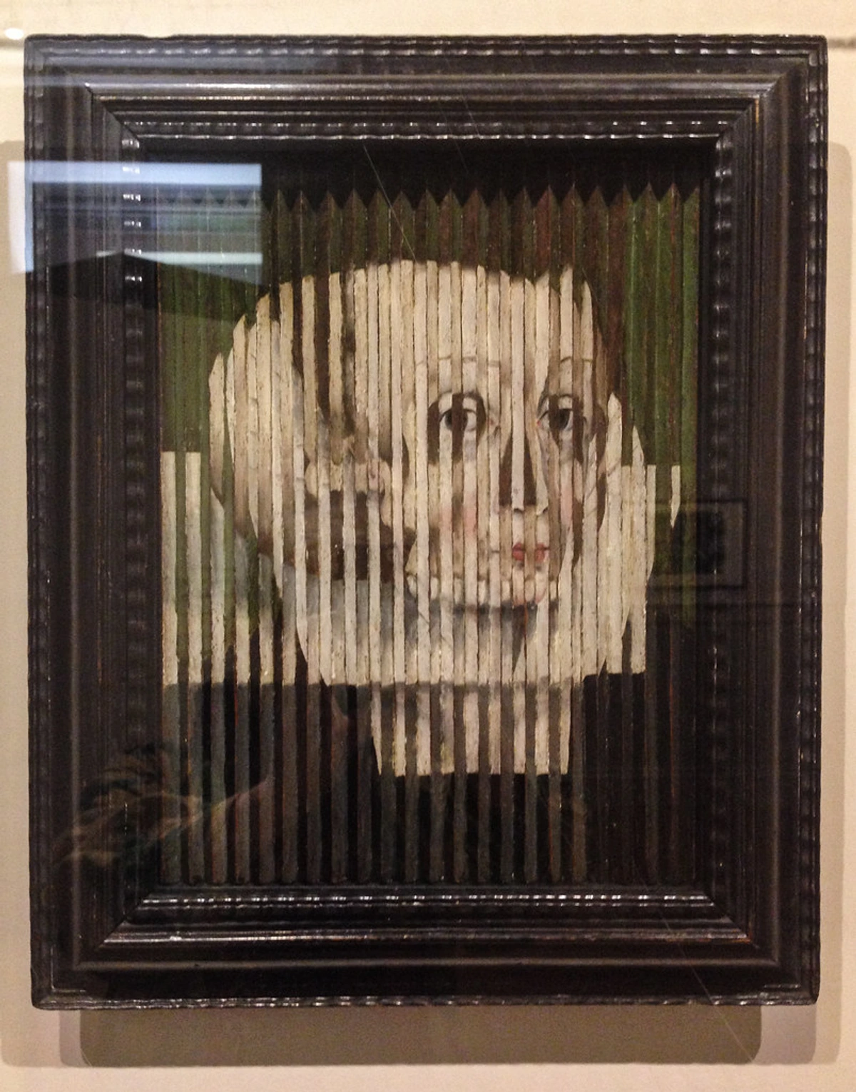 Anamorphic portrait of Mary, Queen of Scots, created with vertical stripes to distort the image.