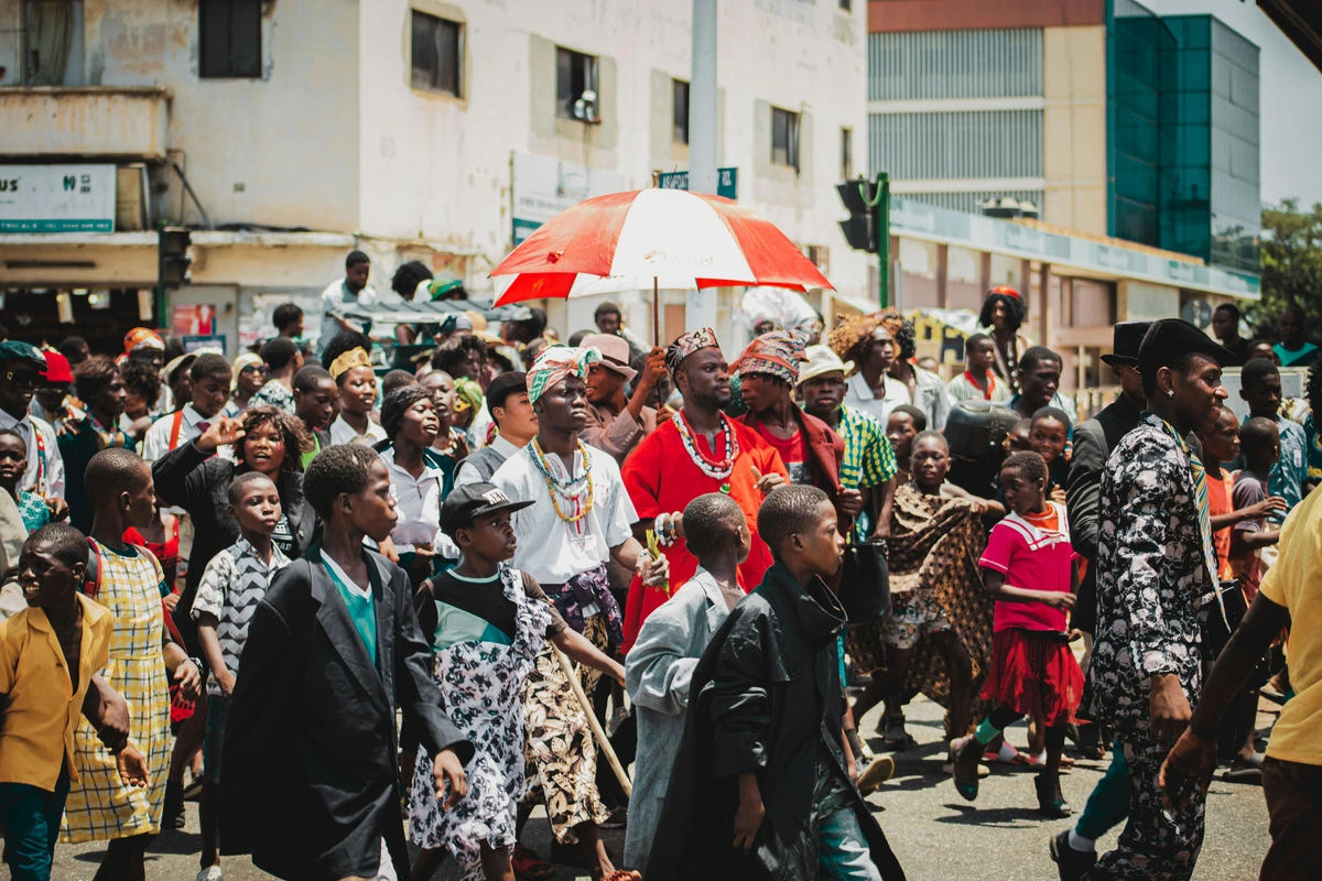 People celebrating civic pride during a street festival in Africa.