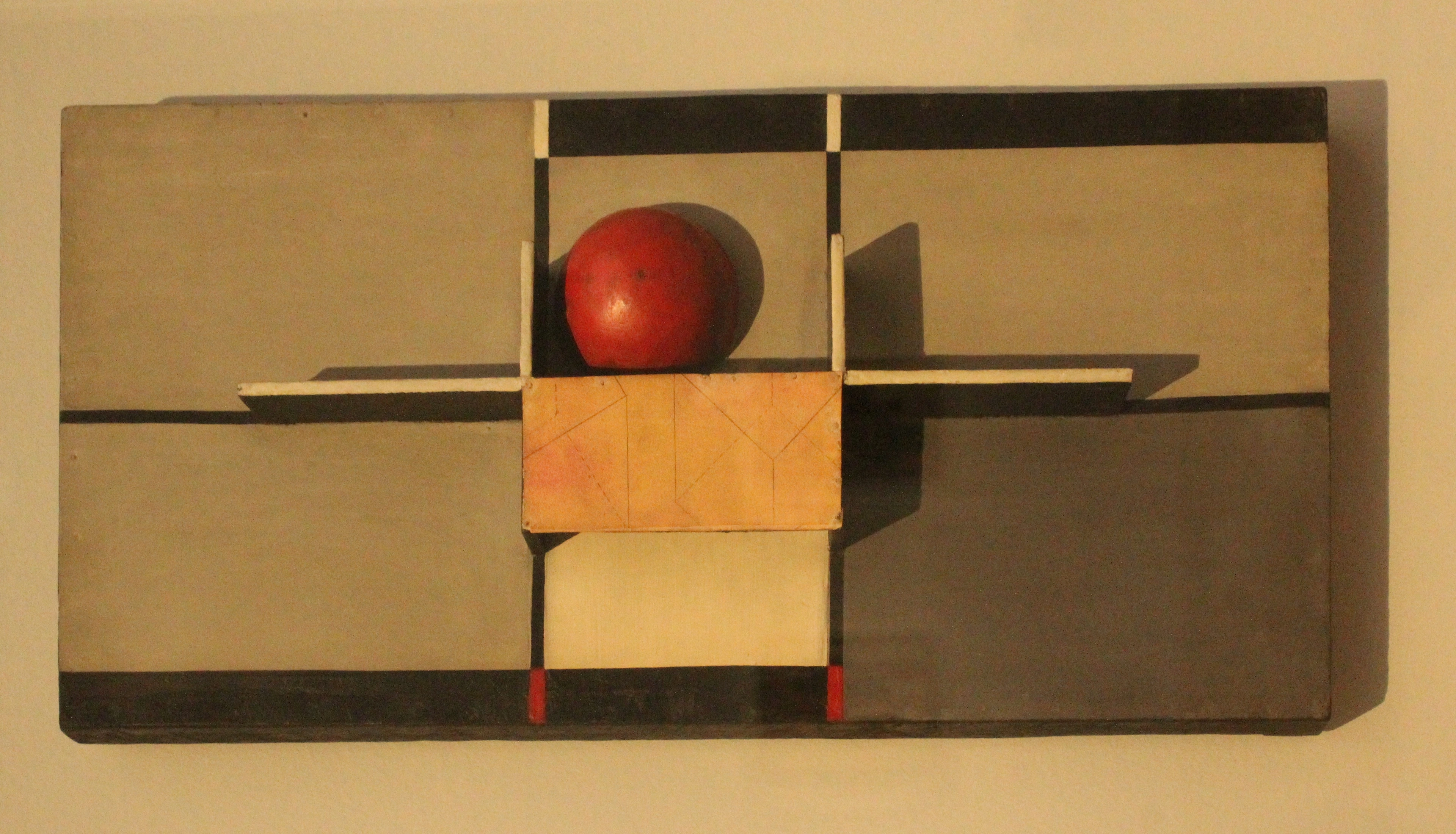 Kurt Schwitters' MERZ Relief mit Kreuz und Kugel (Relief with Cross and Sphere), a Dadaist artwork featuring geometric shapes and a red sphere.