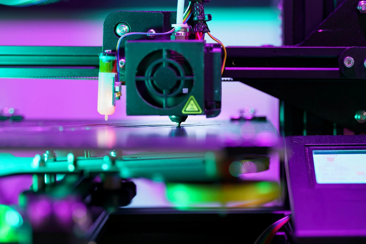 Close-up showing a futuristic 3D printer in operation