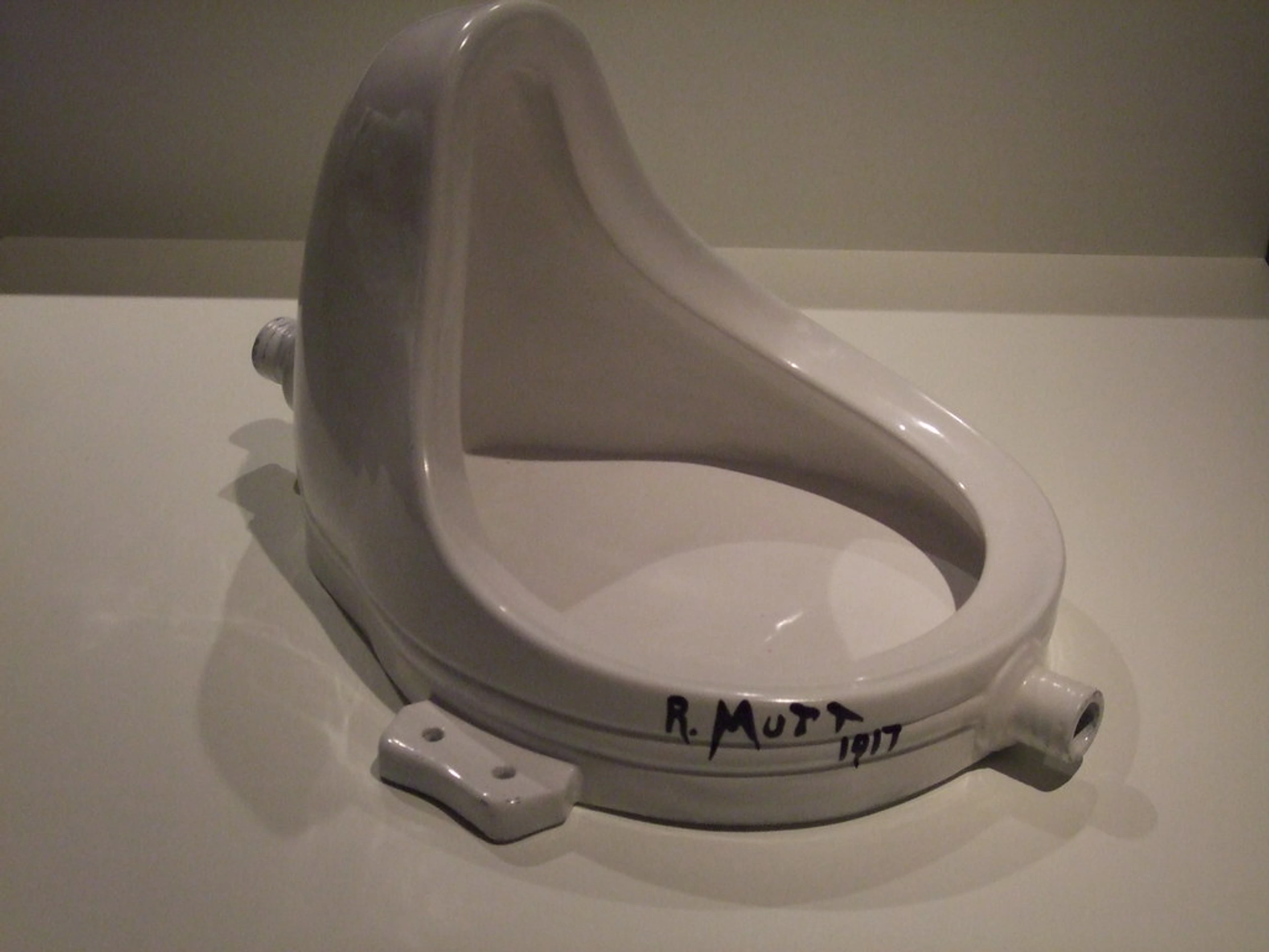 R. Mutt Fountain, a porcelain urinal with the inscription 'R. Mutt 1917,' presented as an art piece.