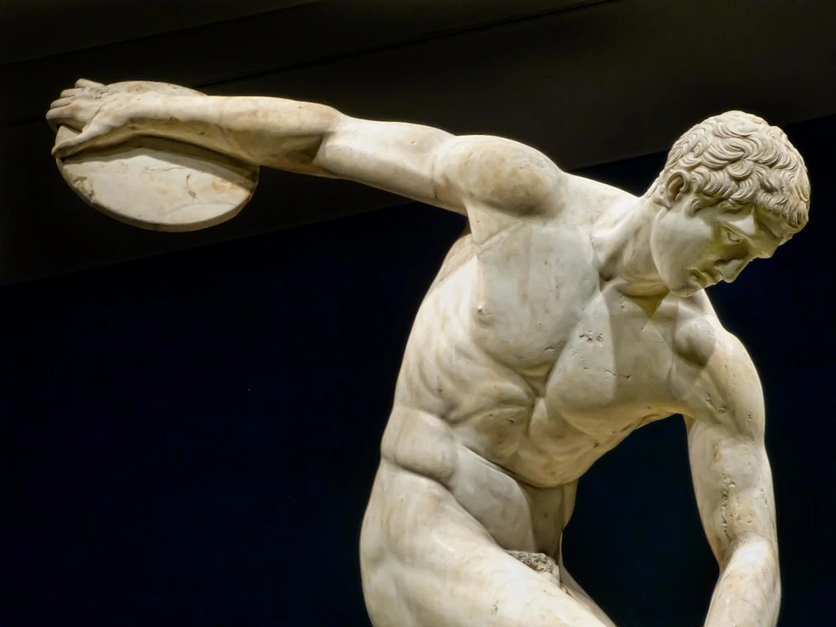 Marble statue of the Diskobolos (Discus Thrower) in a dynamic pose, Roman copy of a Greek original.
