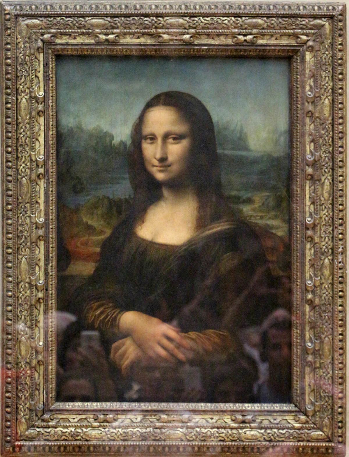 Leonardo da Vinci's Mona Lisa, a Renaissance portrait painting known for its enigmatic smile and sfumato technique.