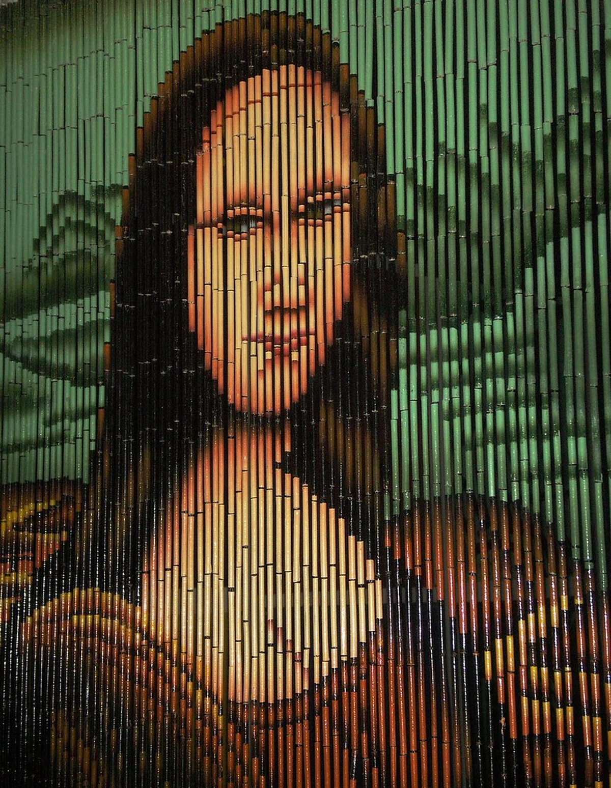 Mona Lisa portrait recreated on a bamboo beaded curtain at Timothy Kent Gallery.