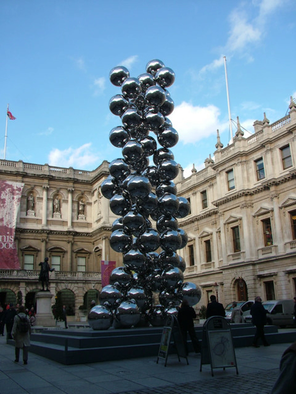 Aneesh Kapur's striking metallic sphere sculpture in the courtyard of the Royal Academy of Arts, London.