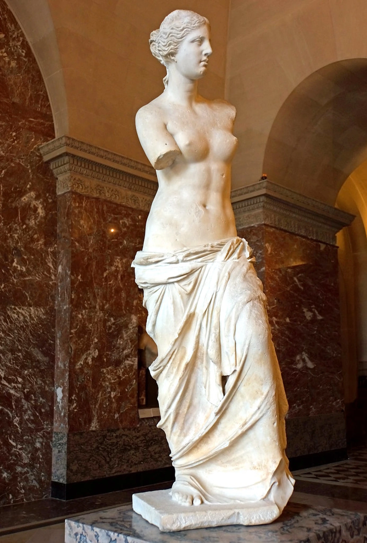 The Venus de Milo, a famous ancient Greek marble statue of Aphrodite, displayed in the Louvre Museum, Paris.