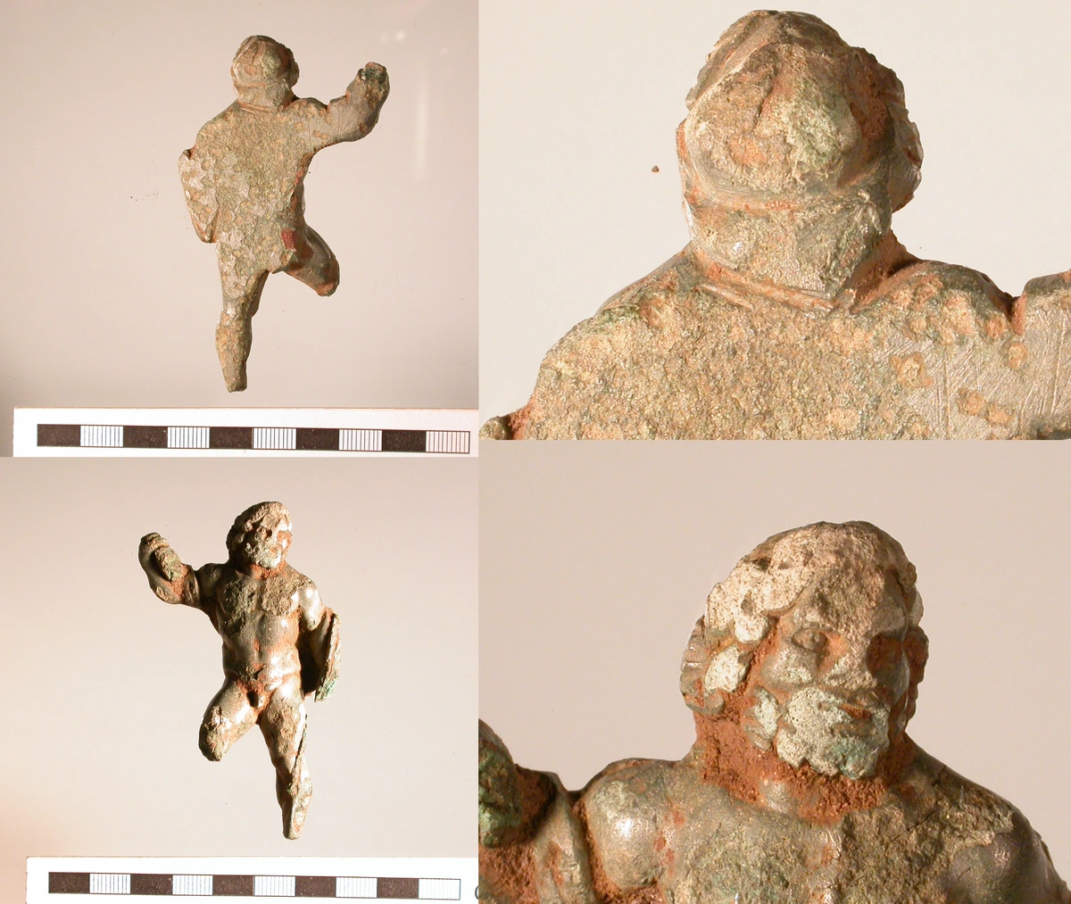 Copper alloy Roman mount or applique in the form of Hercules, showing green patina and terracotta color, with detailed musculature and a heroic pose.