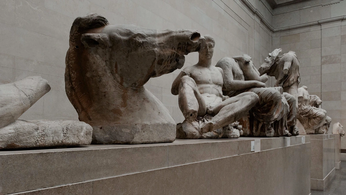 Close-up of the Parthenon's East Pediment sculptures depicting mythological figures in ancient Greek art