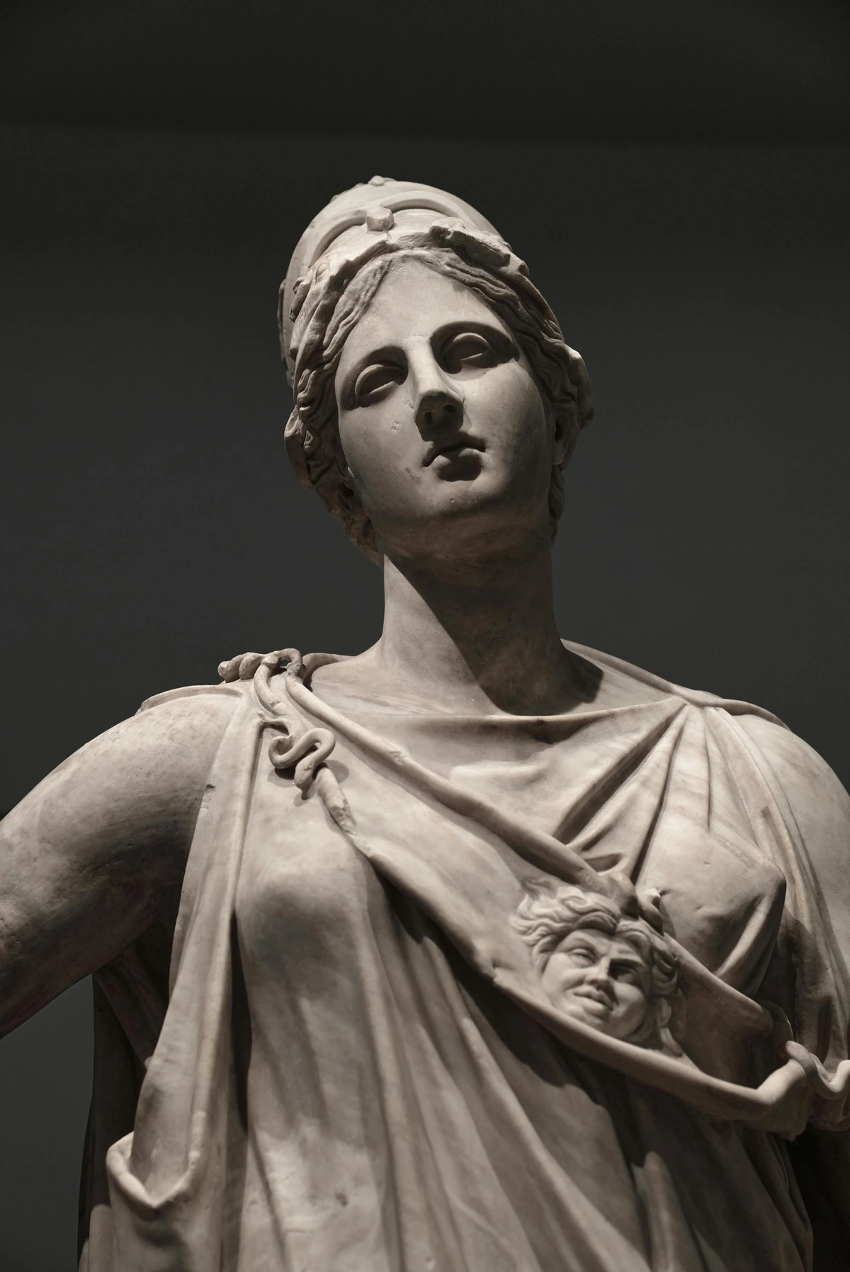 Classic marble statue casting a shadow, symbolizing enduring art, inspired by the context of Carraara marble sculpture artistry in a museum-quality composition.