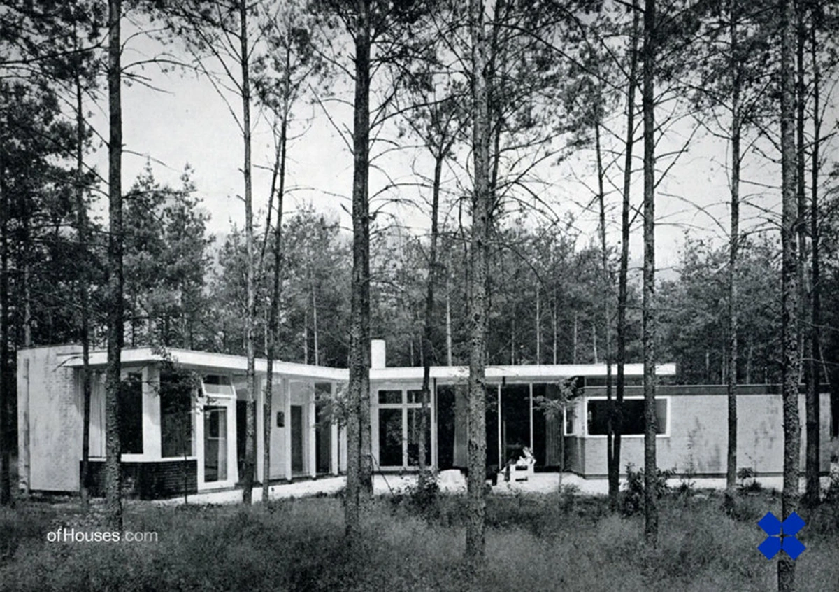 Black and white photograph of Gerrit Rietveld's House Visser architectural design in a forest setting, showcasing minimalist modernist elements.