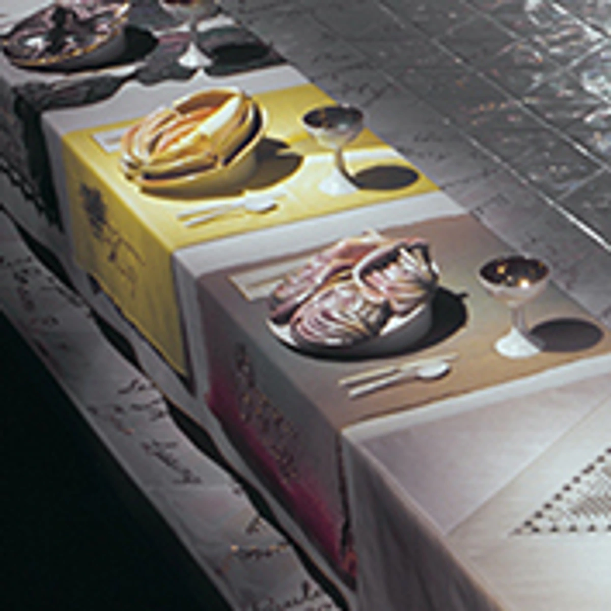 Detail of Judy Chicago's iconic feminist art installation, The Dinner Party, showcasing a meticulously set table with ceramic plates and embroidered textiles.