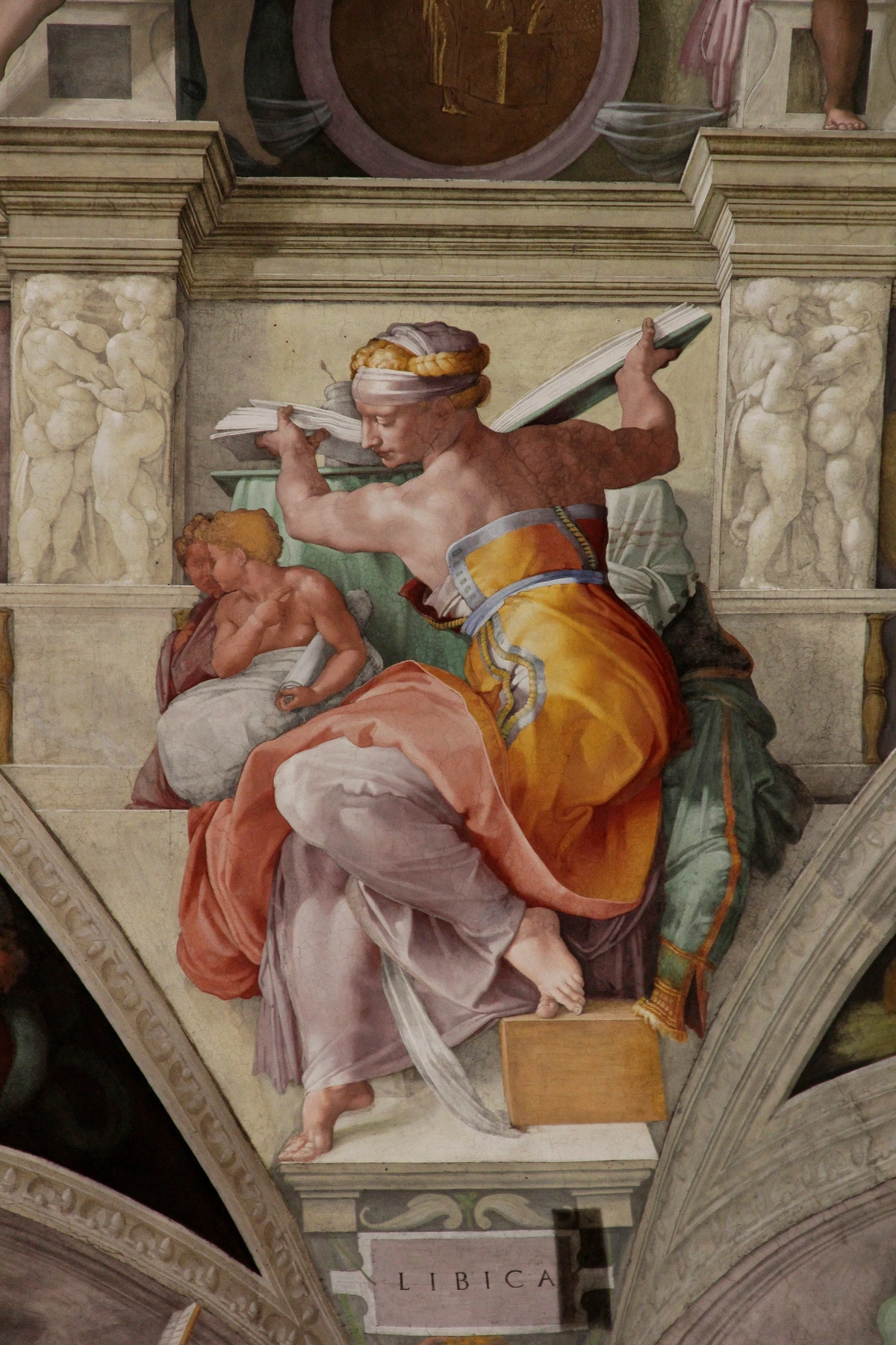 The Libyan Sibyl, a fresco by Michelangelo on the ceiling of the Sistine Chapel, depicted holding a book.