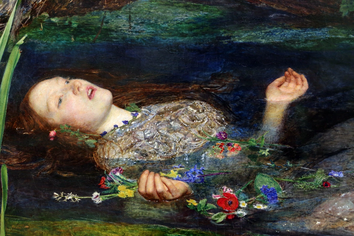 Ophelia drowning in a river, surrounded by flowers, painted by John Everett Millais in 1851-52.