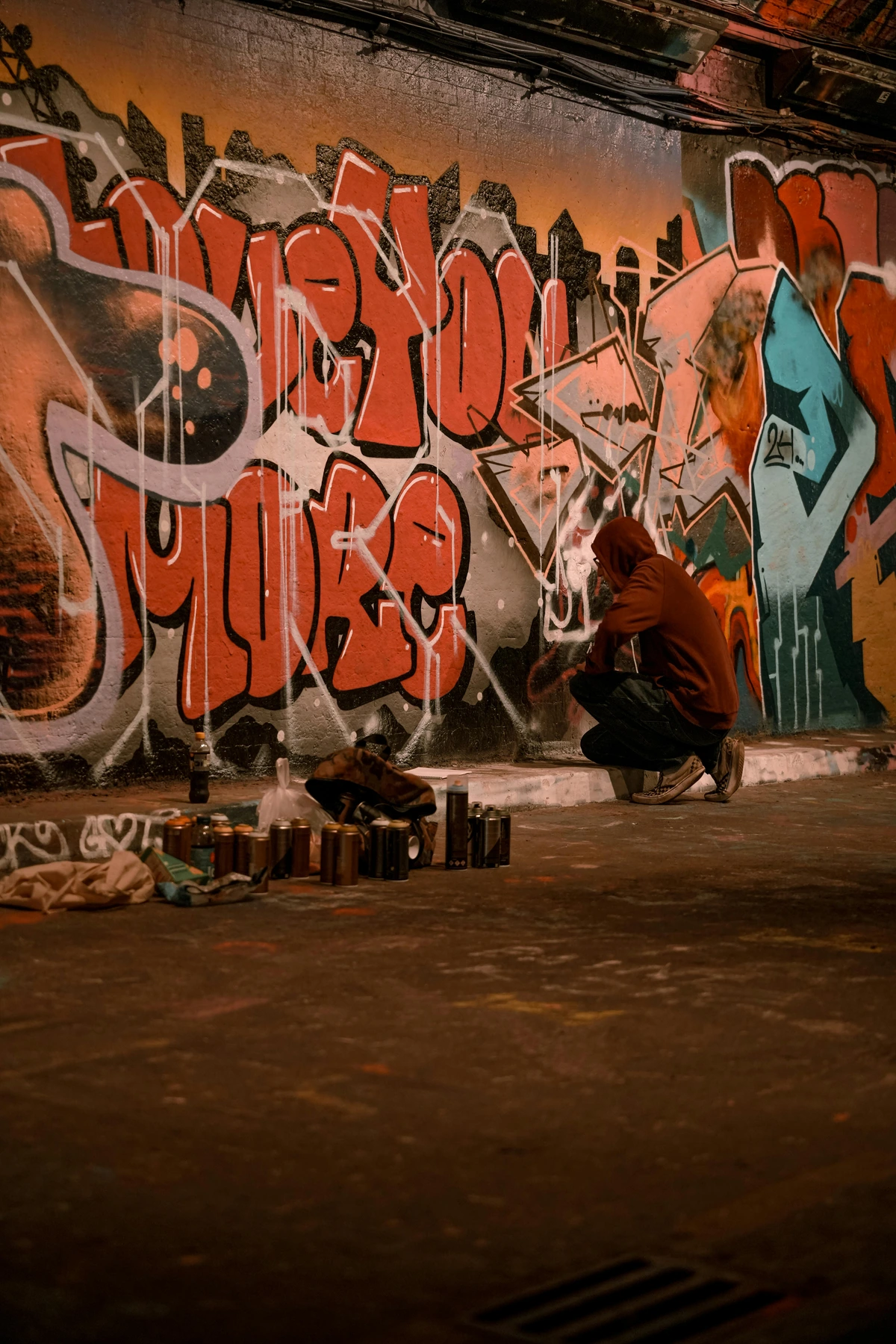 Vibrant street art being created in a London tunnel by a graffiti artist
